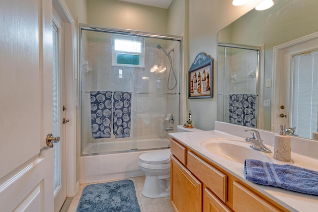 169 Stony Point Dr, Sebastian, FL 32958 - bathroom with vanity, toilet, enclosed tub / shower combo, and tile patterned floors