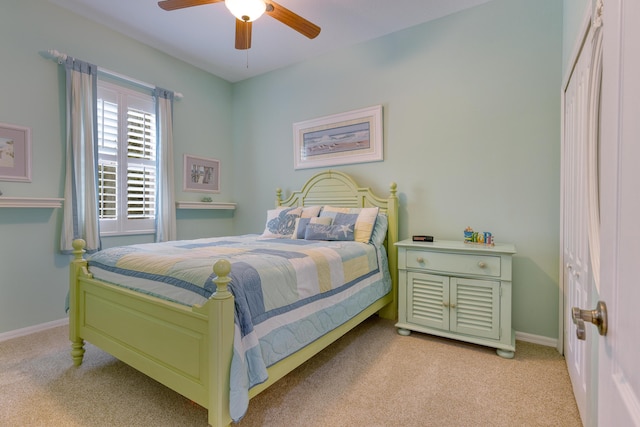 169 Stony Point Dr, Sebastian, FL 32958 - bedroom with light carpet, baseboards, and ceiling fan