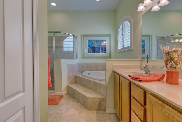 169 Stony Point Dr, Sebastian, FL 32958 - full bath featuring plenty of natural light, a shower stall, a garden tub, tile patterned floors, and recessed lighting