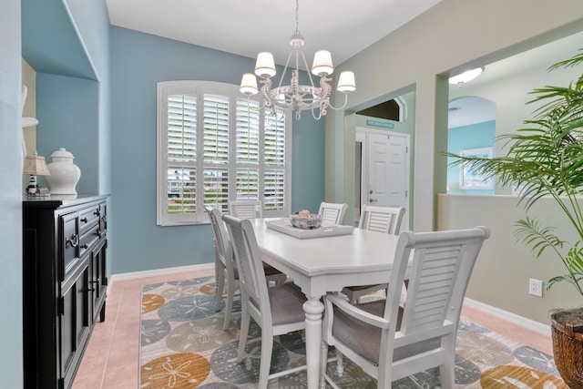 169 Stony Point Dr, Sebastian, FL 32958 - dining area with a chandelier, baseboards, and light tile patterned flooring