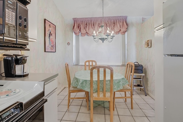 7610 Tahiti Ln Unit 201, Lake Worth, FL 33467 - dining room featuring a chandelier, light tile patterned floors, and wallpapered walls
