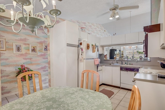 7610 Tahiti Ln Unit 201, Lake Worth, FL 33467 - kitchen featuring white appliances, light tile patterned floors, ceiling fan, lofted ceiling, and white cabinets