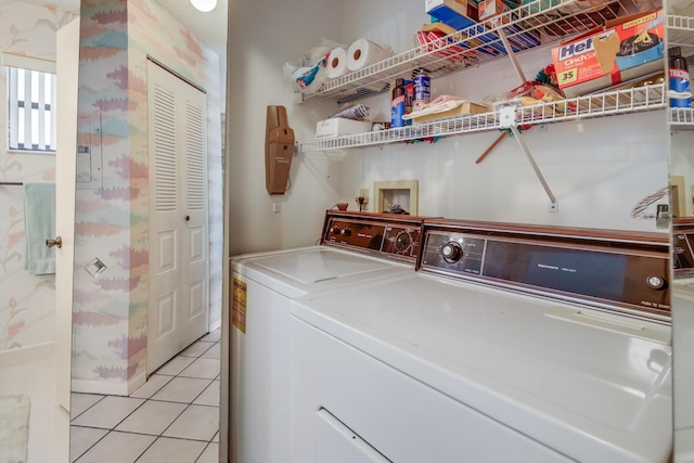 7610 Tahiti Ln Unit 201, Lake Worth, FL 33467 - laundry room with washer and clothes dryer and light tile patterned floors