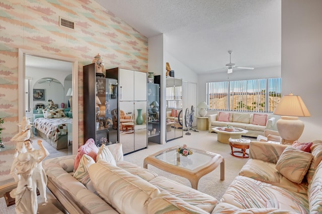 7610 Tahiti Ln Unit 201, Lake Worth, FL 33467 - living area featuring a ceiling fan, light carpet, a textured ceiling, and high vaulted ceiling