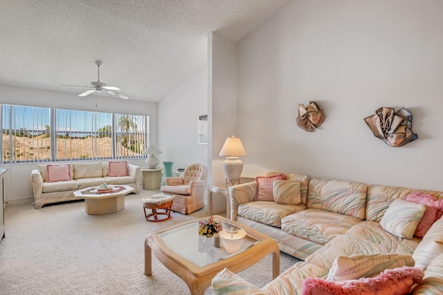 7610 Tahiti Ln Unit 201, Lake Worth, FL 33467 - living area with lofted ceiling, a ceiling fan, a textured ceiling, and carpet flooring
