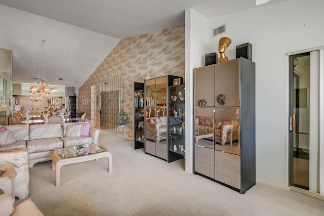 7610 Tahiti Ln Unit 201, Lake Worth, FL 33467 - carpeted living area with lofted ceiling, wallpapered walls, and a chandelier