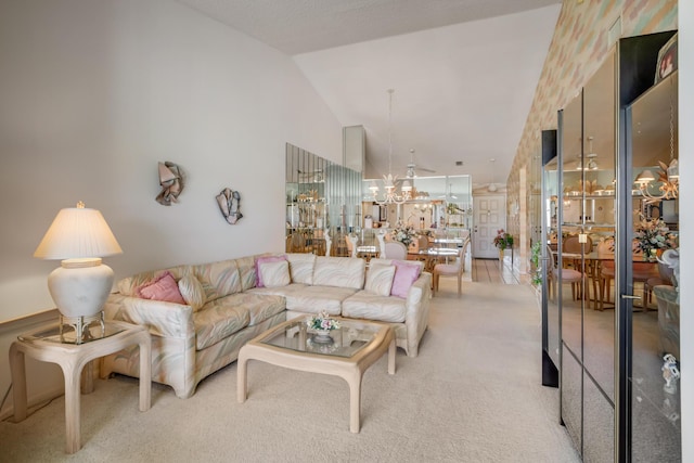 7610 Tahiti Ln Unit 201, Lake Worth, FL 33467 - living room featuring light colored carpet, a chandelier, and vaulted ceiling