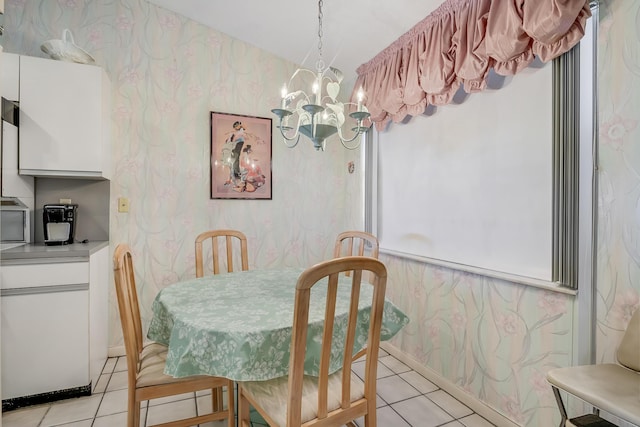 7610 Tahiti Ln Unit 201, Lake Worth, FL 33467 - dining room featuring wallpapered walls, light tile patterned floors, and a chandelier
