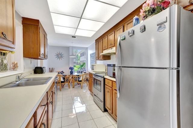 19819 Boca W Dr Unit 4033, Boca Raton, FL 33434 - kitchen with appliances with stainless steel finishes, under cabinet range hood, a sink, light tile patterned floors, and light countertops