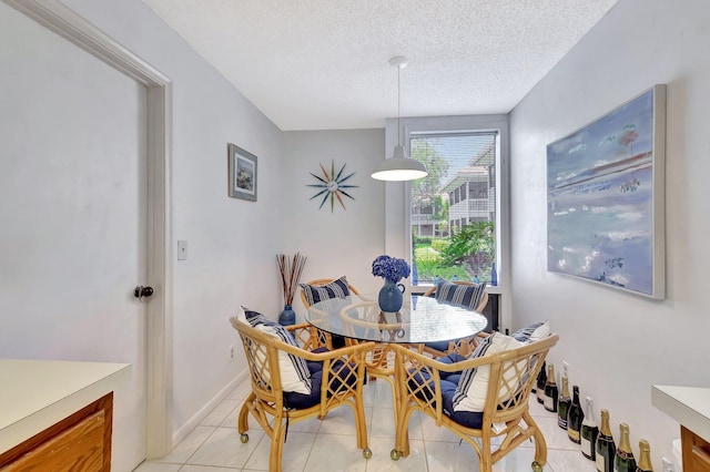19819 Boca W Dr Unit 4033, Boca Raton, FL 33434 - dining space featuring light tile patterned flooring and a textured ceiling