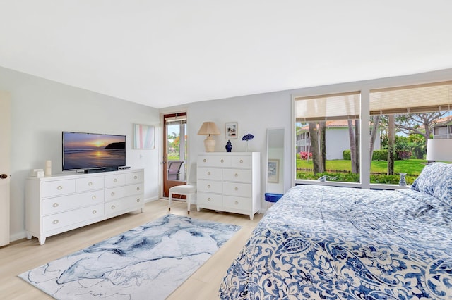 19819 Boca W Dr Unit 4033, Boca Raton, FL 33434 - bedroom with wood finished floors and baseboards