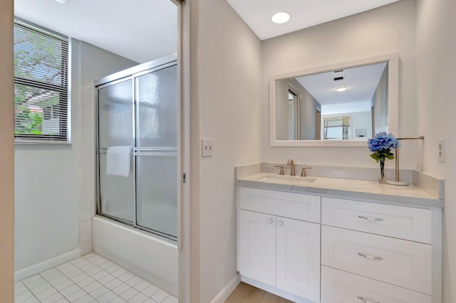 19819 Boca W Dr Unit 4033, Boca Raton, FL 33434 - full bath featuring baseboards, vanity, bath / shower combo with glass door, and tile patterned floors