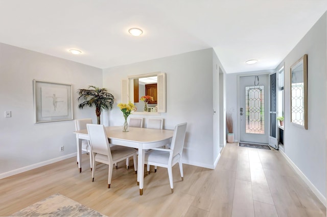 19819 Boca W Dr Unit 4033, Boca Raton, FL 33434 - dining space with light wood-style flooring and baseboards