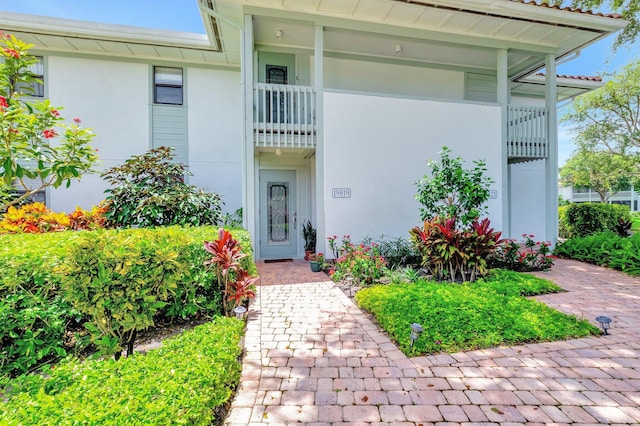 19819 Boca W Dr Unit 4033, Boca Raton, FL 33434 - doorway to property with stucco siding