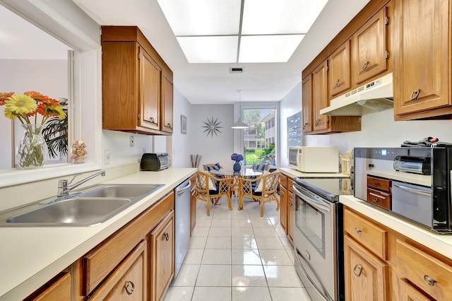 19819 Boca W Dr Unit 4033, Boca Raton, FL 33434 - kitchen featuring appliances with stainless steel finishes, a sink, light countertops, and light tile patterned flooring