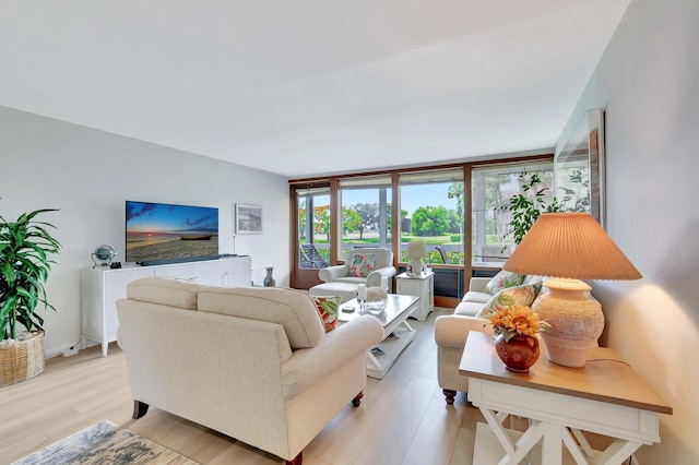 19819 Boca W Dr Unit 4033, Boca Raton, FL 33434 - living room featuring light wood-type flooring
