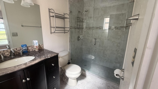 425 Lake Helen Dr, West Palm Beach, FL 33411 - bathroom with toilet, a shower stall, and vanity
