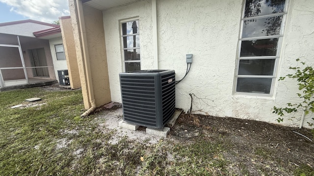 425 Lake Helen Dr, West Palm Beach, FL 33411 - exterior view of stucco siding and central air condition unit