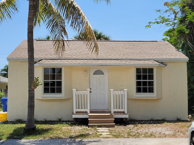 510 N 5th St, Lantana, FL 33462 - view of front of home featuring stucco siding and roof with shingles