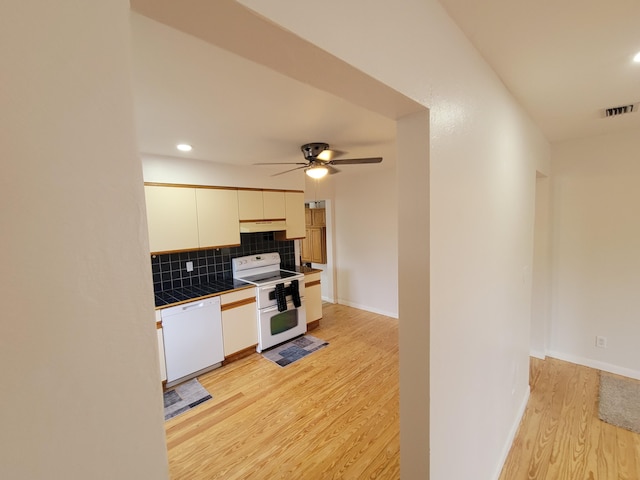 510 N 5th St, Lantana, FL 33462 - kitchen featuring white appliances, tile countertops, light wood-type flooring, backsplash, and a ceiling fan