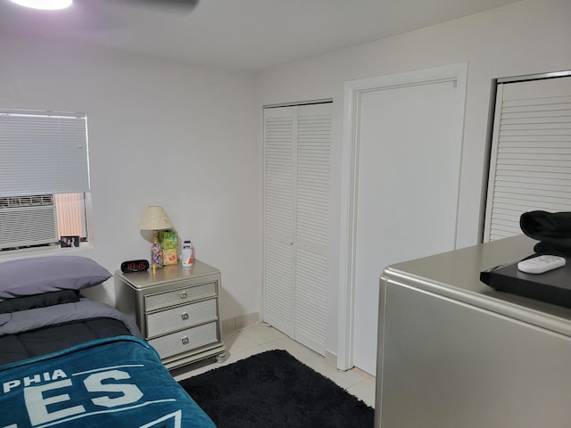 510 N 5th St, Lantana, FL 33462 - bedroom with light tile patterned flooring, cooling unit, fridge, and baseboards