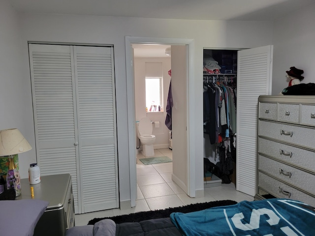 510 N 5th St, Lantana, FL 33462 - bedroom with light tile patterned flooring, baseboards, and ensuite bathroom
