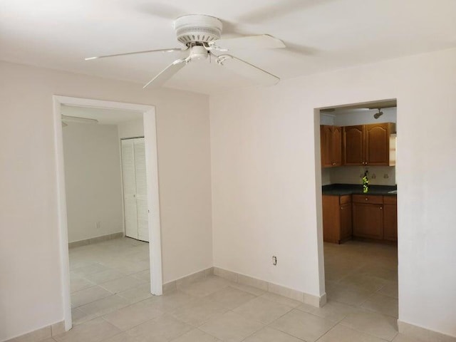 510 N 5th St, Lantana, FL 33462 - unfurnished room with ceiling fan, light tile patterned floors, and baseboards