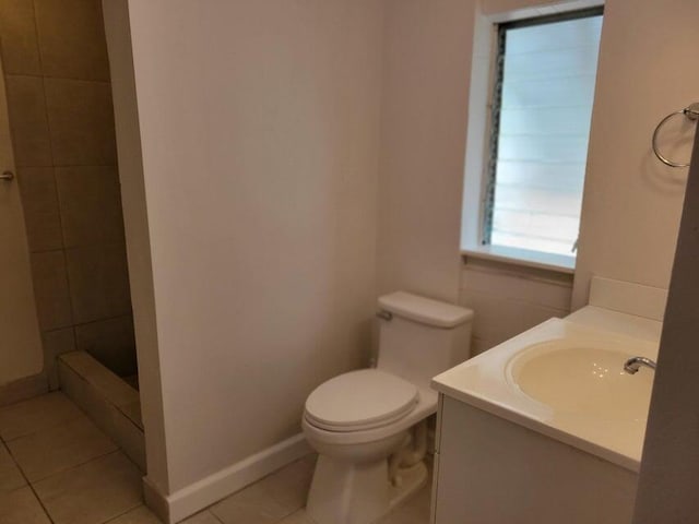 510 N 5th St, Lantana, FL 33462 - full bathroom featuring tile patterned flooring, tiled shower, baseboards, toilet, and vanity