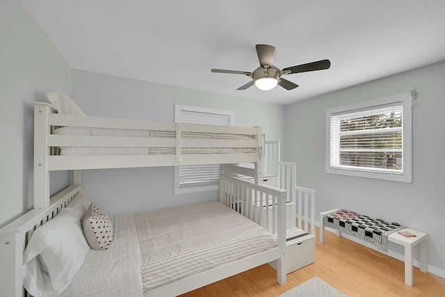 2135 NE 4th Way, Boca Raton, FL 33431 - bedroom with wood finished floors, baseboards, and a ceiling fan