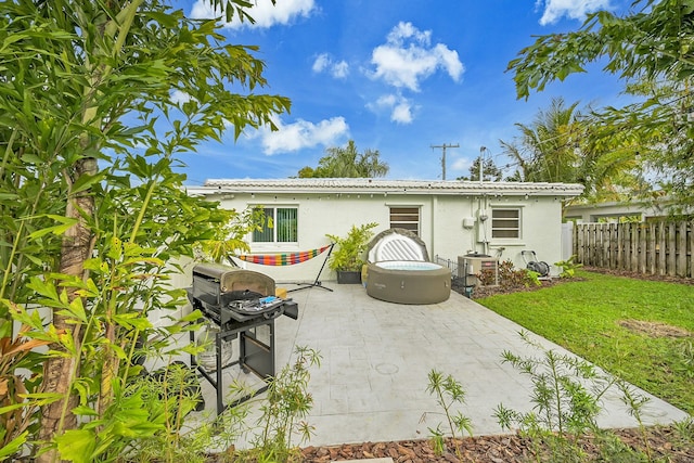 2135 NE 4th Way, Boca Raton, FL 33431 - back of property with stucco siding and a patio area