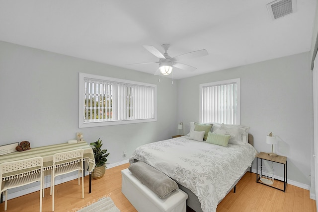 2135 NE 4th Way, Boca Raton, FL 33431 - bedroom featuring baseboards, wood finished floors, and a ceiling fan