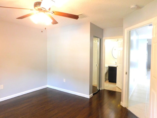 2470 NW 99th Way Unit 2470, Sunrise, FL 33322 - empty room featuring dark wood-type flooring, ceiling fan, and a smoke detector