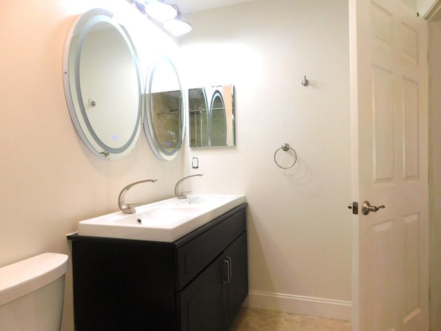 2470 NW 99th Way Unit 2470, Sunrise, FL 33322 - bathroom featuring double vanity and toilet