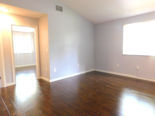 2470 NW 99th Way Unit 2470, Sunrise, FL 33322 - spare room featuring healthy amount of natural light and dark wood-style floors