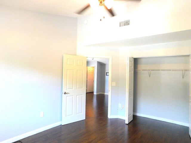 2470 NW 99th Way Unit 2470, Sunrise, FL 33322 - unfurnished bedroom with dark wood-style flooring, a closet, and a ceiling fan