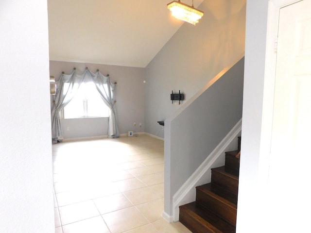 2470 NW 99th Way Unit 2470, Sunrise, FL 33322 - foyer featuring stairs, tile patterned floors, and vaulted ceiling