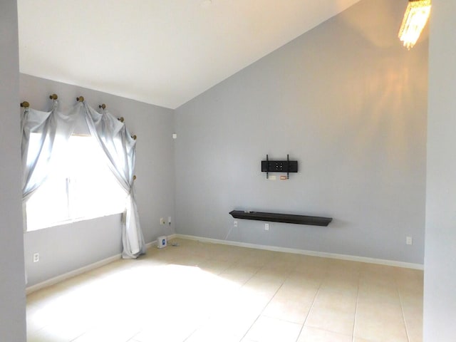 2470 NW 99th Way Unit 2470, Sunrise, FL 33322 - tiled spare room with lofted ceiling and baseboards