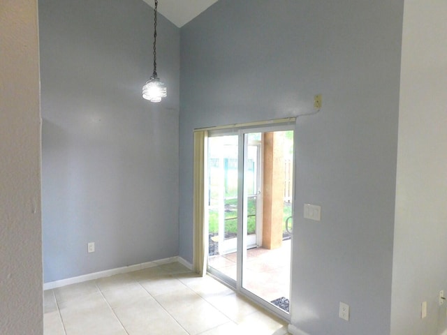2470 NW 99th Way Unit 2470, Sunrise, FL 33322 - empty room with high vaulted ceiling and light tile patterned floors