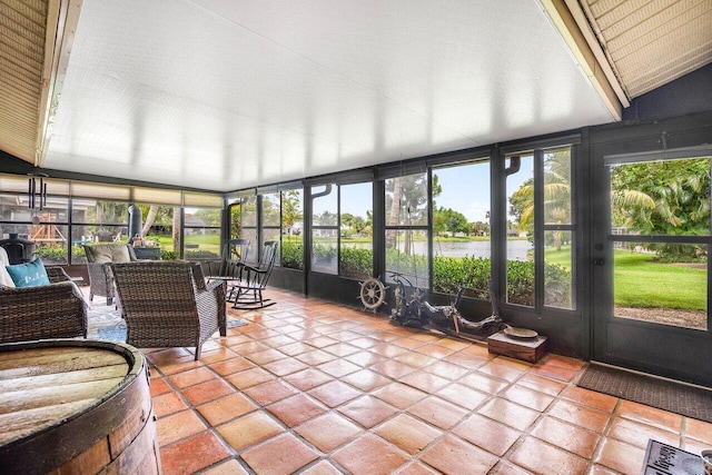 129 Parkwood Dr, Royal Palm Beach, FL 33411 - sunroom featuring tile patterned flooring, french doors, floor to ceiling windows, and a water view
