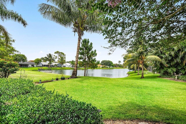 129 Parkwood Dr, Royal Palm Beach, FL 33411 - view of green lawn featuring a water view
