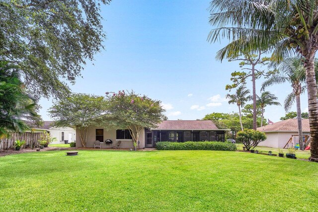 129 Parkwood Dr, Royal Palm Beach, FL 33411 - rear view of property featuring stucco siding