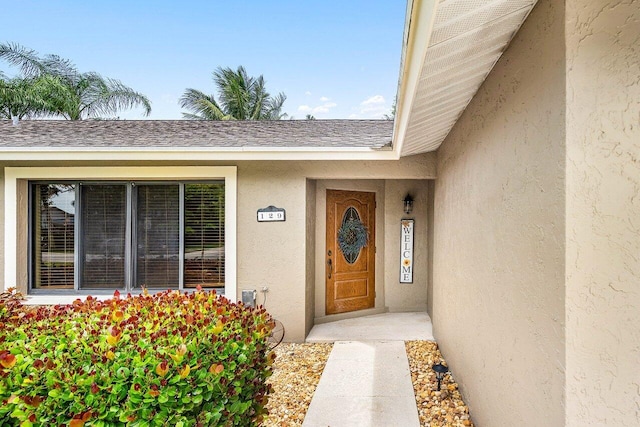 129 Parkwood Dr, Royal Palm Beach, FL 33411 - view of exterior entry featuring stucco siding