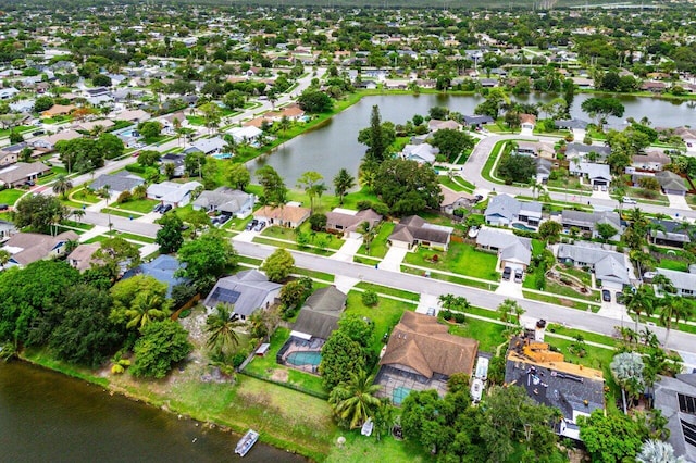 129 Parkwood Dr, Royal Palm Beach, FL 33411 - aerial view of property and surrounding area with a large body of water and nearby suburban area