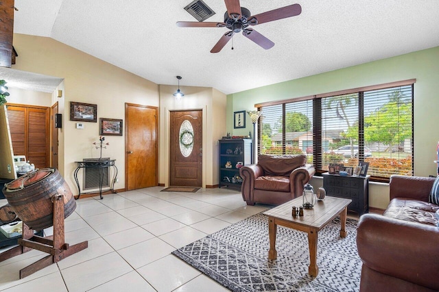 129 Parkwood Dr, Royal Palm Beach, FL 33411 - living room with lofted ceiling, ceiling fan, a textured ceiling, light tile patterned flooring, and baseboards
