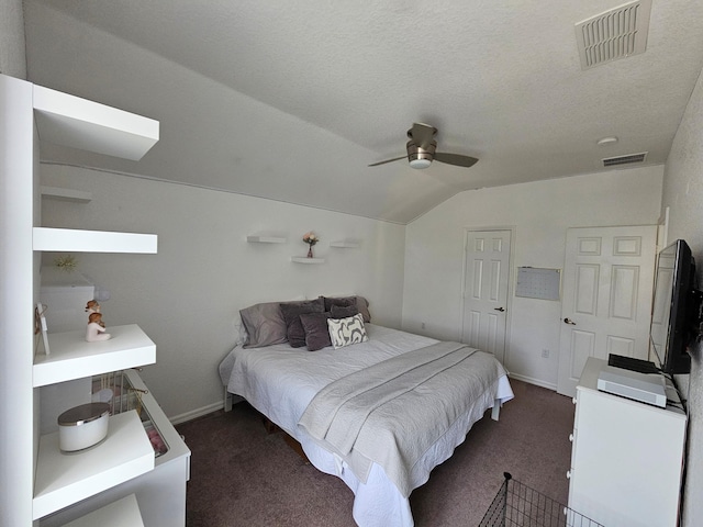 426 Cadiz Loop, Davenport, FL 33837 - bedroom with dark colored carpet, vaulted ceiling, ceiling fan, and baseboards