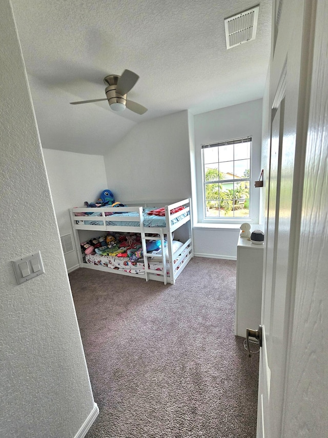 426 Cadiz Loop, Davenport, FL 33837 - bedroom featuring carpet flooring, a textured ceiling, a ceiling fan, and baseboards
