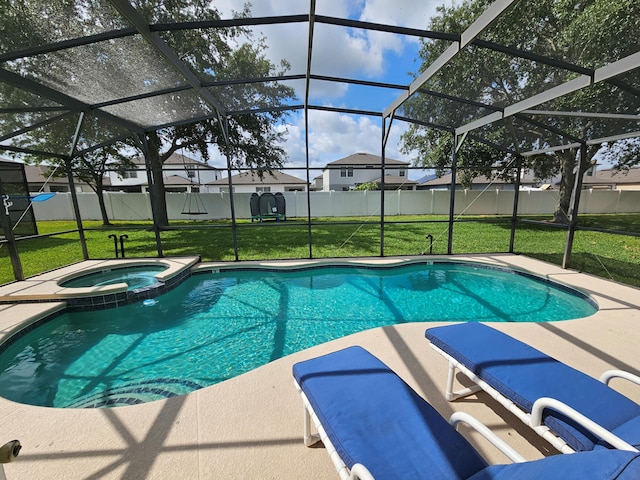 426 Cadiz Loop, Davenport, FL 33837 - view of pool with glass enclosure, a pool with connected hot tub, a residential view, and a patio area