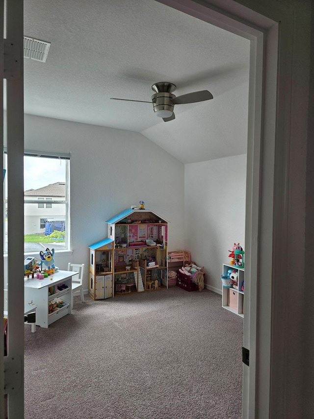 426 Cadiz Loop, Davenport, FL 33837 - playroom featuring carpet, a ceiling fan, and lofted ceiling