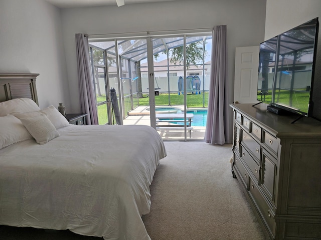 426 Cadiz Loop, Davenport, FL 33837 - carpeted bedroom featuring access to outside, a sunroom, and multiple windows