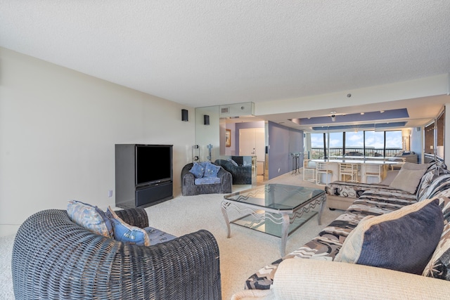 4740 S Ocean Blvd Unit 1403, Highland Beach, FL 33487 - carpeted living room featuring a textured ceiling